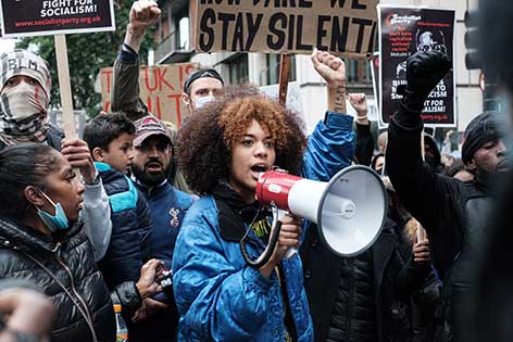 Young activist speaking into megaphone